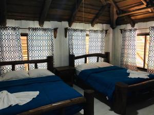 Voodi või voodid majutusasutuse Hotel Samsara toas