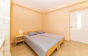 Ένα ή περισσότερα κρεβάτια σε δωμάτιο στο Apartments Old grandfather's house +26 φωτογραφίες