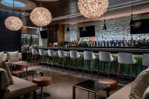 a bar at a restaurant with stools at Palms Place Hotel and Spa in Las Vegas
