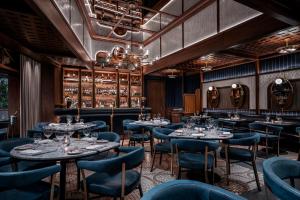 a restaurant with tables and chairs and a bar at Palms Casino Resort in Las Vegas