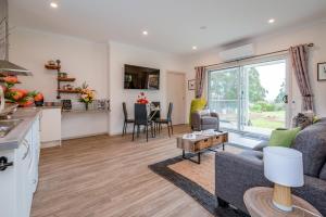 a living room with a couch and a table at Erriba House in Erriba