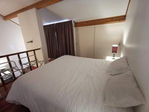 Postel nebo postele na pokoji v ubytování Apartamentos da Galé