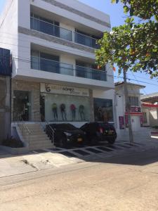 a black car parked in front of a building at Hotel Platinum Barranquilla in Barranquilla