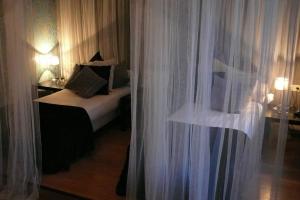 Postel nebo postele na pokoji v ubytování Hotel Matuchi