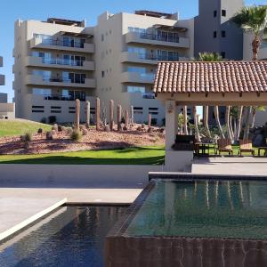 a swimming pool in front of a building at Corona Del Sol 1104, Puerto Peñasco, Las Conchas in Puerto Peñasco