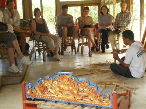 a group of people sitting around a table at Puri Lumbung Cottages Restaurant & Spa Munduk in Munduk