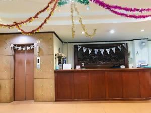a lobby with a reception desk at BP Grand Hotel in Chiang Mai