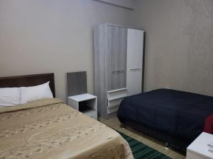 Cama o camas de una habitación en Class Apart Hotel
