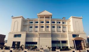a large white building with a dome on top at Zone by The Park, Jammu in Jammu