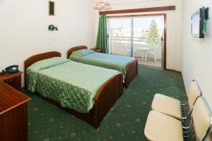 TV a/nebo společenská místnost v ubytování Marion Hotel