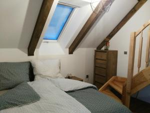 מיטה או מיטות בחדר ב-Apartmán Barborka 05