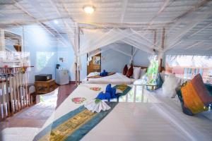 a bedroom with two beds in a room at Lipe Beach Resort in Ko Lipe