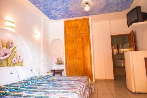 Postel nebo postele na pokoji v ubytování Hotel La Alondra
