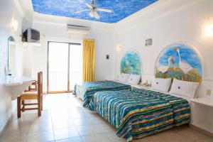 Postel nebo postele na pokoji v ubytování Hotel La Alondra + 37 fotografií