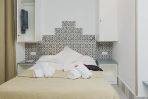 Postel nebo postele na pokoji v ubytování Hostal Gravina