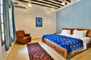Kendwa Rocks Hotel tesisinde bir odada yatak veya yataklar