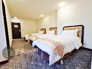 Postel nebo postele na pokoji v ubytování Chang Hong Hotel