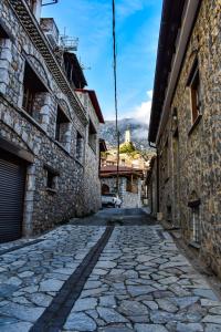 an alley in an old town with buildings at Dio Studios in Arachova