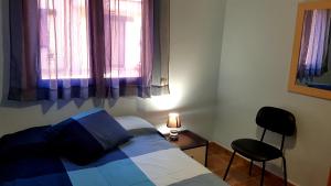 A bed or beds in a room at Piso Don Mateo en Sierra de Gredos