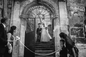 a bride and groom standing in a doorway at Antica Torre di Iuso in Matera