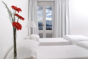 Una cama o camas en una habitación de Hotel Tunquelén