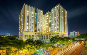 a large building with lights on in a city at night at Căn hộ Nghỉ Dưỡng Aparment Melody Vũng Tàu - Tomorrow Homestay 1 in Vung Tau