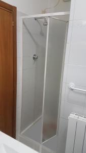 a shower with a glass door in a bathroom at Casa Nadia in Perugia +14 photos