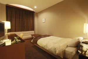 Postelja oz. postelje v sobi nastanitve Hotel Grand Vert Gizan