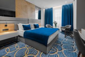 Postel nebo postele na pokoji v ubytování Sky Hotel
