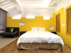 Postel nebo postele na pokoji v ubytování Kenting True Color Hostel