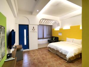 Postel nebo postele na pokoji v ubytování Kenting True Color Hostel