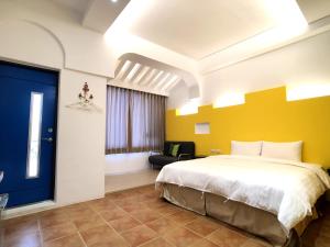 Postel nebo postele na pokoji v ubytování Kenting True Color Hostel