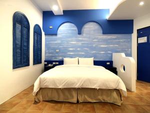 Postel nebo postele na pokoji v ubytování Kenting True Color Hostel