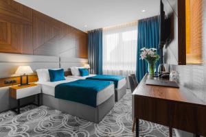 Postel nebo postele na pokoji v ubytování Sky Hotel