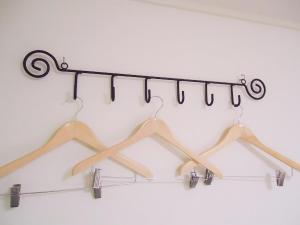 a group of hangers hanging from a rack at Shin-Okubo City Hotel in Tokyo