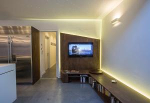 TV a/nebo společenská místnost v ubytování Casa Lodo