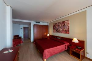 Postel nebo postele na pokoji v ubytování Hotel Torre Normanna