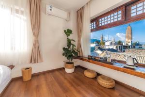 Postel nebo postele na pokoji v ubytování Dali Rong lu Hotel