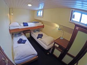 Postel nebo postele na pokoji v ubytování Botel Elodie