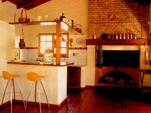 A kitchen or kitchenette at Ca´Montana Hostal Boutique
