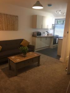 a living room with a couch and a coffee table at St Leonards cottage in Newark upon Trent