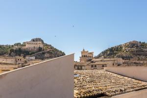 a view of a city from the roof of a building at Scicli Albergo Diffuso in Scicli