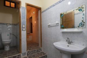 a bathroom with a sink and a toilet at Aroumd Authentic Lodge Managed By Rachid Jellah in Imlil