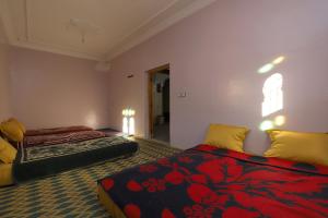 Cama ou camas em um quarto em Aroumd Authentic Lodge Managed By Rachid Jellah