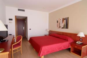 Postel nebo postele na pokoji v ubytování Hotel Torre Normanna