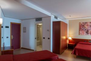 Postel nebo postele na pokoji v ubytování Hotel Torre Normanna