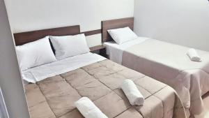 Voodi või voodid majutusasutuse Hotel Sur Brasil toas