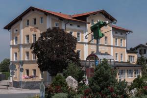 a building with a traffic light in front of it at Gasthof Kampenwand Aschau in Aschau im Chiemgau