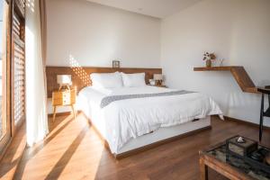 Postel nebo postele na pokoji v ubytování Dali Rong lu Hotel