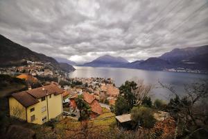 a view of a city and a body of water at El Jardin in Bellano